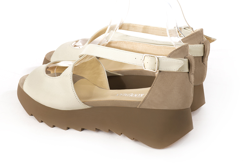 Off white and tan beige women's closed back sandals, with crossed straps. Round toe. Low rubber soles. Rear view - Florence KOOIJMAN